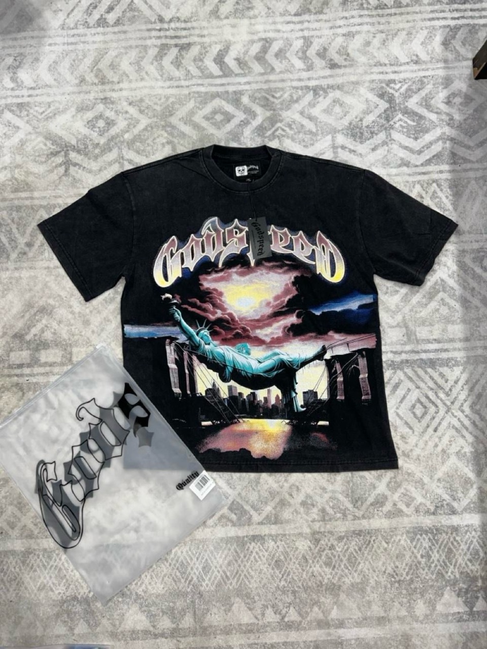 Godspeed Graphic Black Tee with Statue of Liberty Sunset